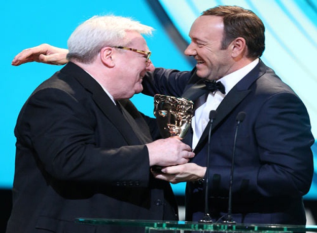 Alan Parker receives his Bafta lifetime achievement award from Kevin Spacey