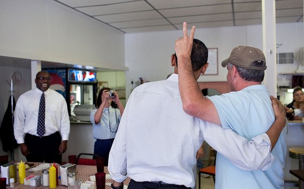 April 28, 2010 "Sometimes the unexpected happens. At a cafe in Missouri, I was trying to capture patrons snapping photos of each other with the President when this guy did what wise-guys do." (Official White House Photo by Pete Souza) This official White House photograph is being made available only for publication by news organizations and/or for personal use printing by the subject(s) of the photograph. The photograph may not be manipulated in any way and may not be used in commercial or political materials, advertisements, emails, products, promotions that in any way suggests approval or endorsement of the President, the First Family, or the White House.