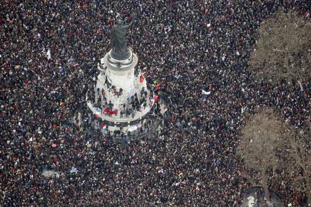 -- AFP PICTURES OF THE YEAR 2015 -- Aerial view taken on January 11, 2015 shows people attending the Unity rally Marche Republicaine at the Place de la Republique (Republique's square) in Paris in tribute to the 17 victims of a three-day killing spree by homegrown Islamists. The killings began on January 7 with an assault on the Charlie Hebdo satirical magazine in Paris that saw two brothers massacre 12 people including some of the country's best-known cartoonists, the killing of a policewoman and the storming of a Jewish supermarket on the eastern fringes of the capital which killed 4 local residents. AFP PHOTO / KENZO TRIBOUILLARD / AFP / KENZO TRIBOUILLARD