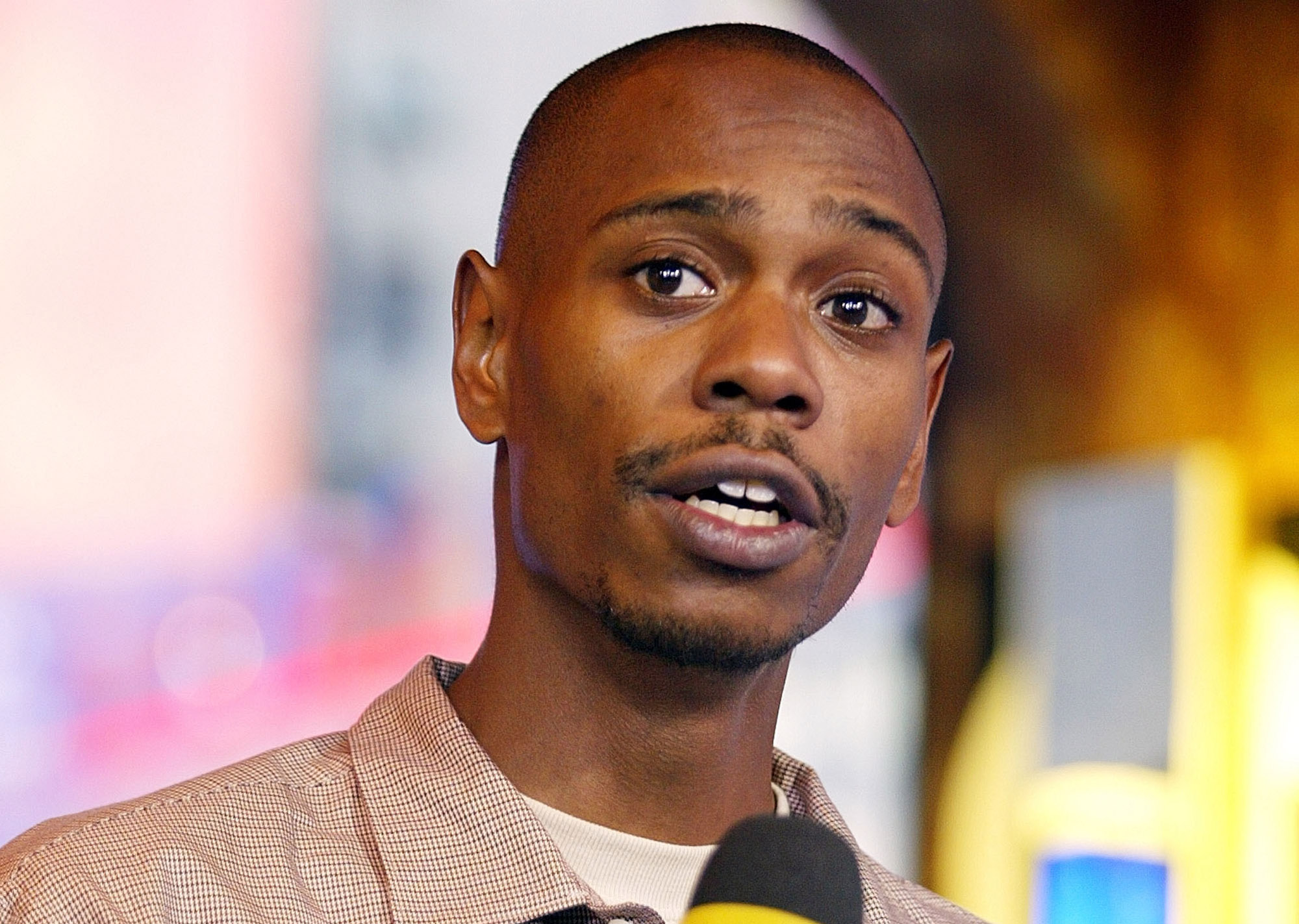 NEW YORK - SEPTEMBER 8: (FILE PHOTO) (U.S. TABS OUT) Comedian Dave Chapelle appears on stage during MTV's Total Request Live at the MTV Times Square Studios September 8, 2003 in New York City. It's been reported in a U.S entertainment magazine May 11, 2005 that Chapelle has checked into a mental health facility in South Africa. (Photo by Scott Gries/Getty Images)